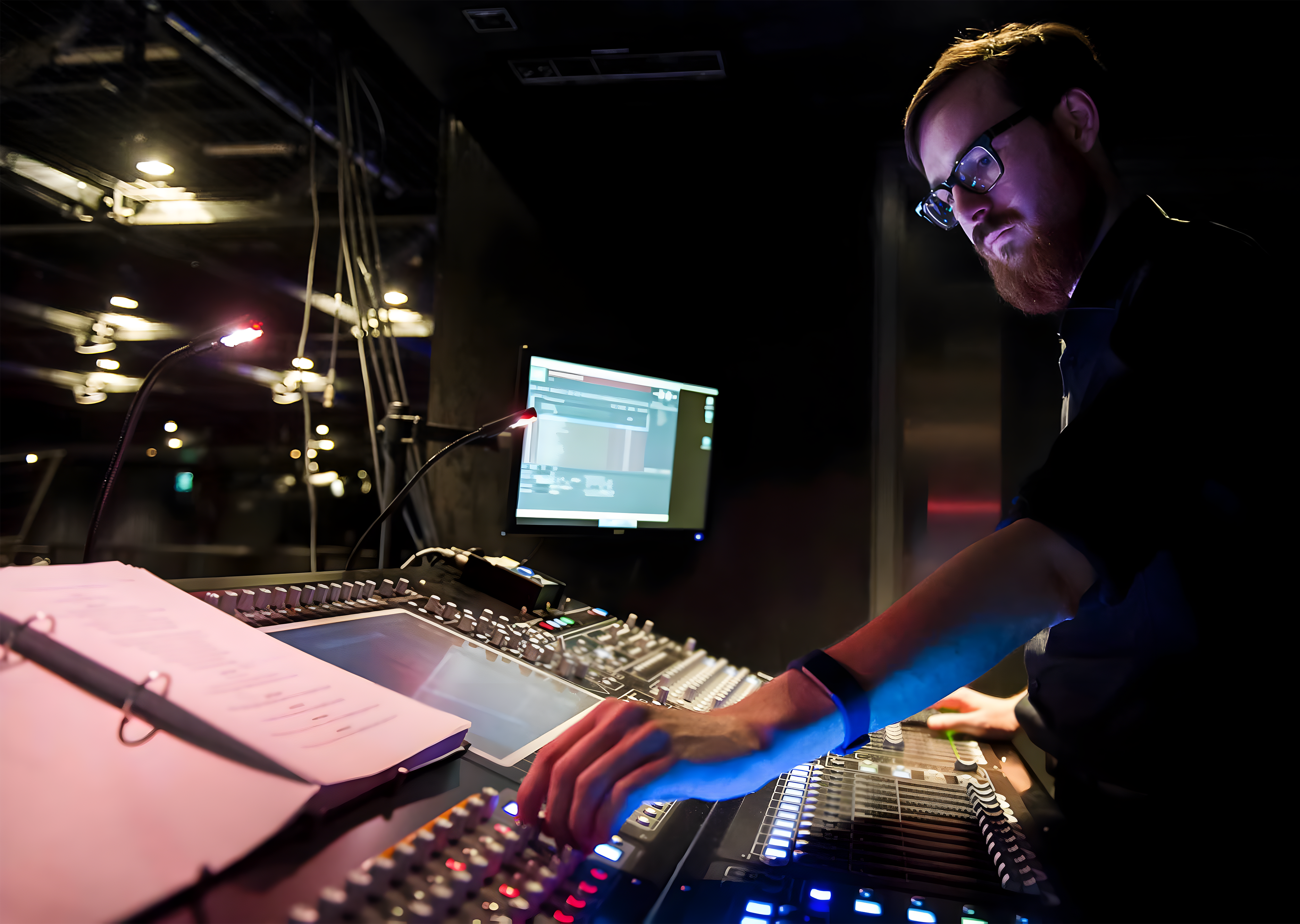 Patrick Barnes operating a sound console.